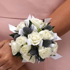 WHITE SWEETHEART ROSES AND BLUE THISTLE WRIST CORSAGE
